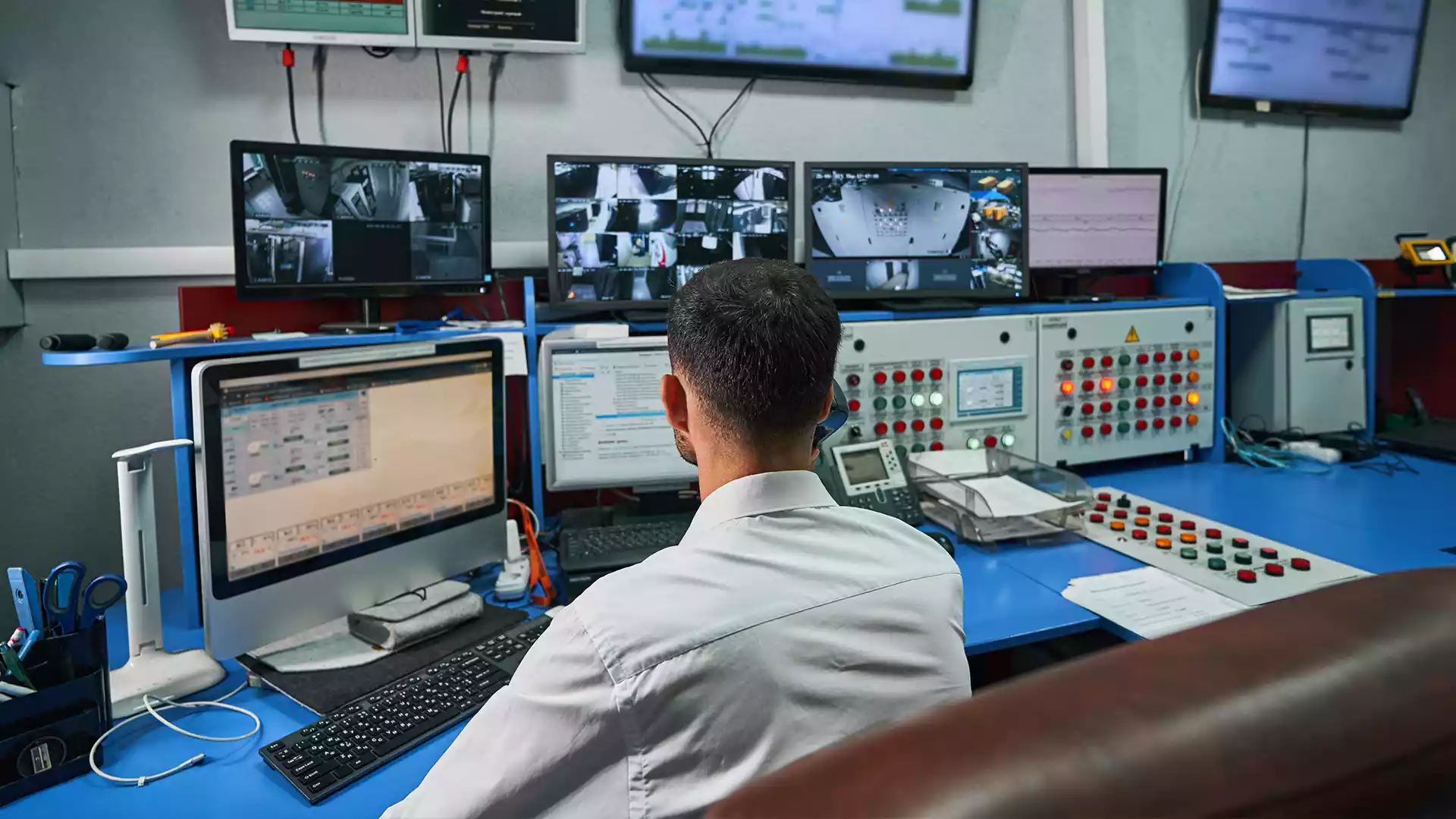 Security looking at monitors